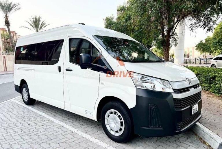 A white van parked in a parking lot, representing a van rental service with a driver in Dubai.