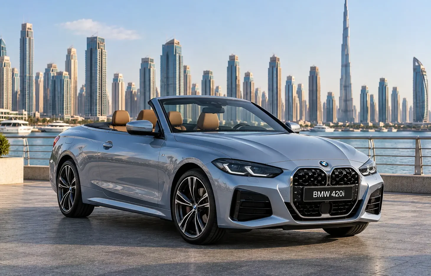 The image shows a metallic grey BMW 420i Convertible parked against a waterfront backdrop with a city skyline featuring the Burj Khalifa in Dubai.
