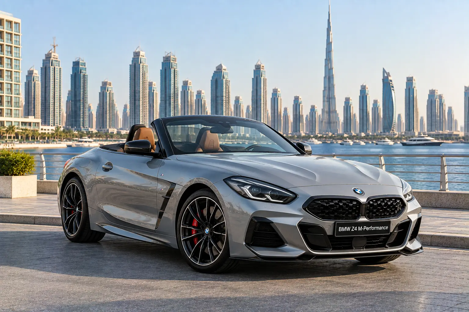 The image shows a silver BMW Z4 M-Performance roadster parked with a city skyline backdrop featuring the Burj Khalifa in Dubai.