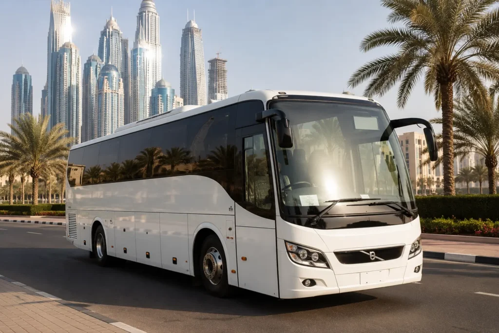 Modern 30 Seater Luxury Bus in Dubai parked beside a palm-lined boulevard with Dubai's skyline, offering comfortable transportation for corporate events, family trips, and sightseeing groups.