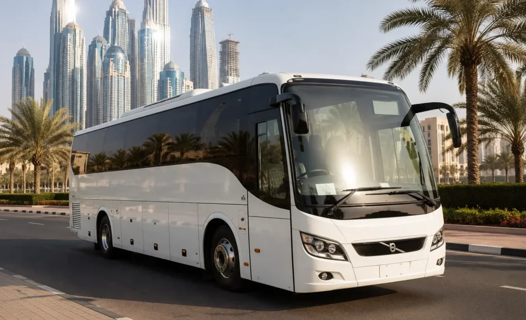 Modern 30 Seater Luxury Bus in Dubai parked beside a palm-lined boulevard with Dubai's skyline, offering comfortable transportation for corporate events, family trips, and sightseeing groups.