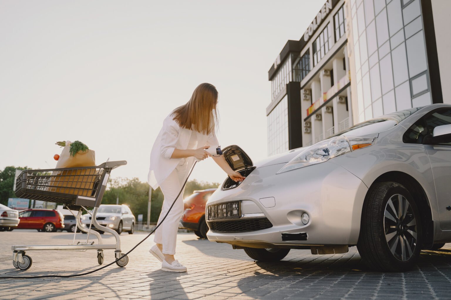 What are the benefits of renting hybrid or electric cars?