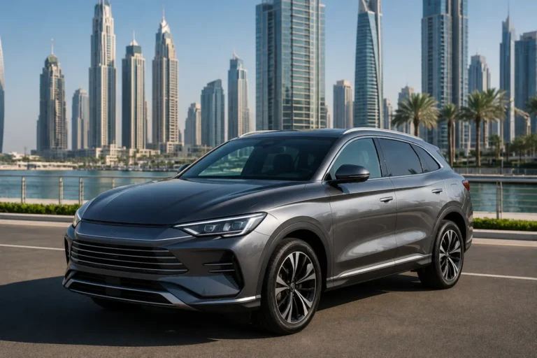 Grey BYD Song Plus 2024 parked on a Dubai boulevard with the modern skyline and waterfront in the background.