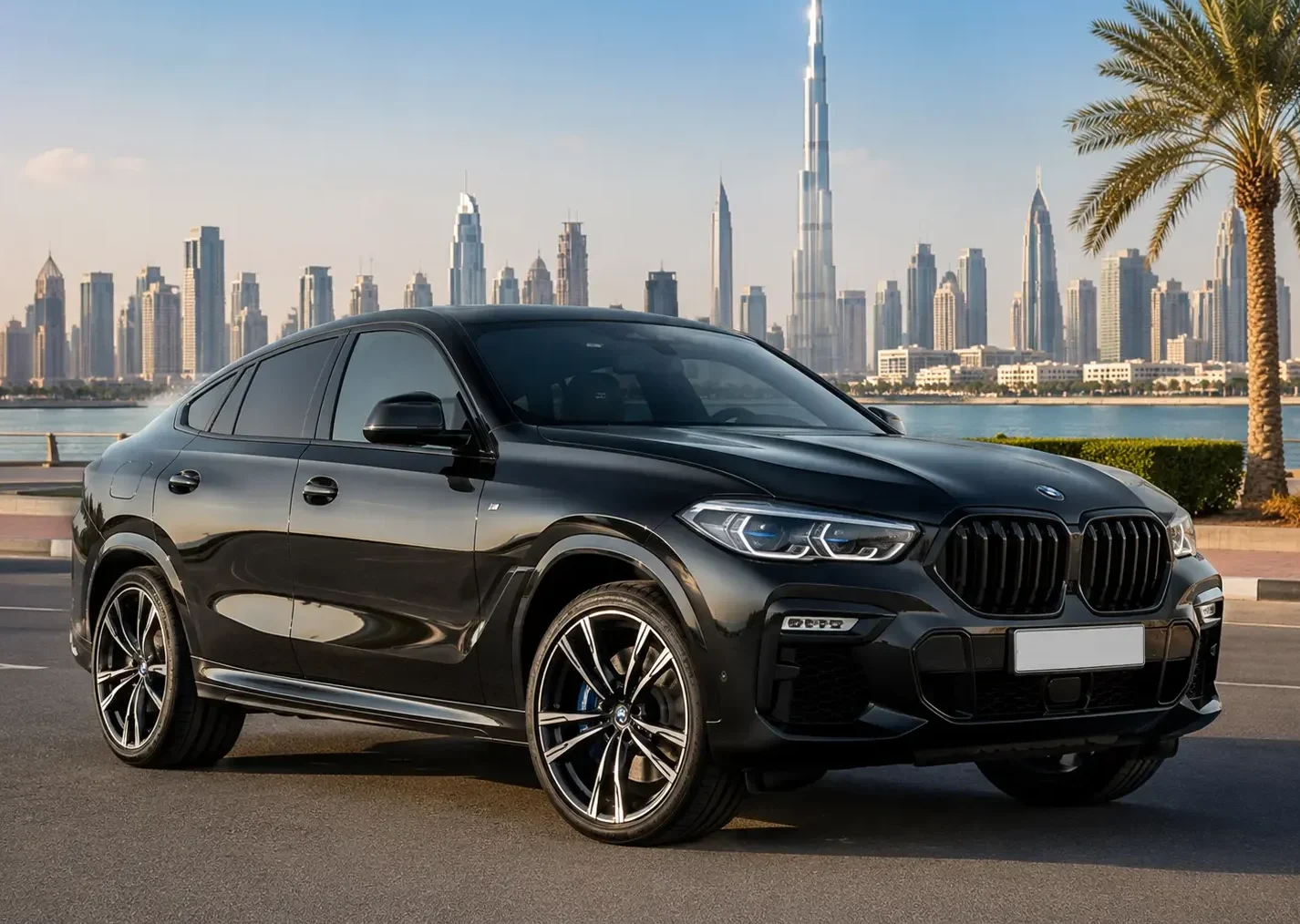 BMW X6 xDrive40i rental Dubai luxury SUV parked with the iconic Dubai skyline in the background, showcasing a premium black exterior and elegant design for chauffeur-driven travel.