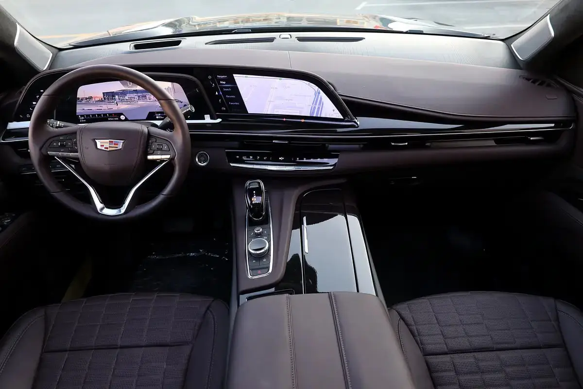 The image appears to show the interior dashboard and front seating area of a recent-generation Cadillac Escalade.